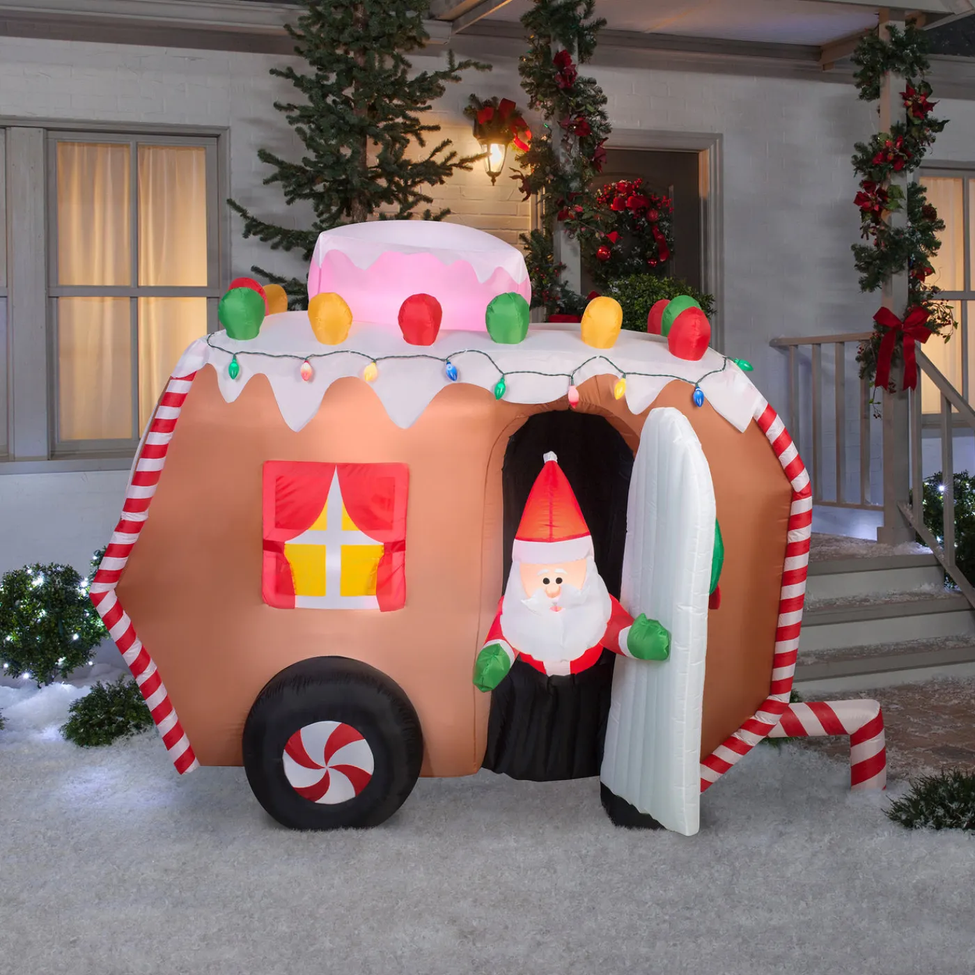 National Tree Company 7.5 ft. Inflatable Gingerbread Trailer with Santa with LED Lights
