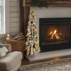 National Tree Company 4 ft. Pre-Lit Snowy Downswept Forest Tree with Clear Lights