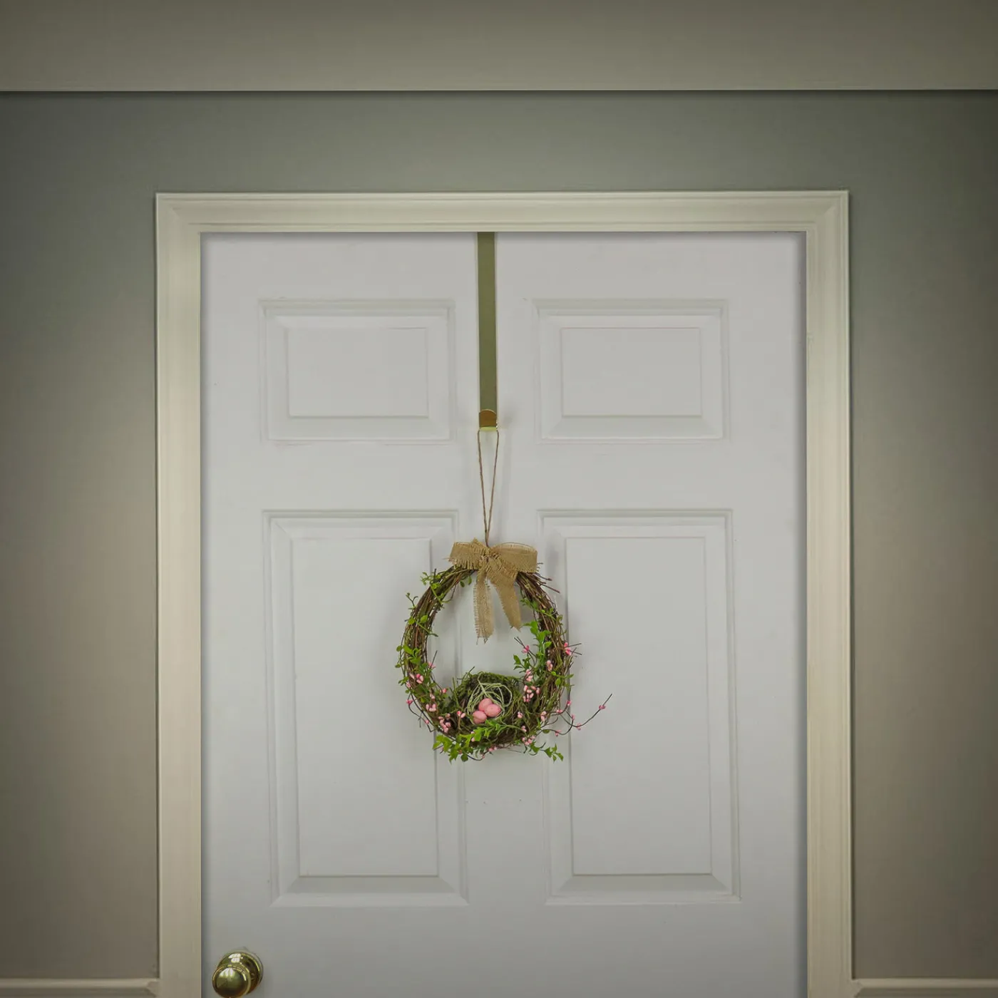 National Tree Company 11 in. Easter Bird's Nest Hanging Wall Decoration Decorated with Leafy Greens and Pastel Eggs
