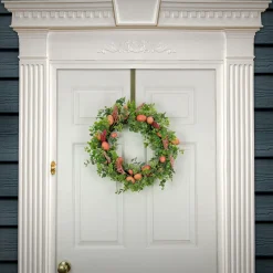 National Tree Company 22 in. Easter Wreath Decorated with Pink Pastel Eggs, Pink Flowers, Leafy Greens