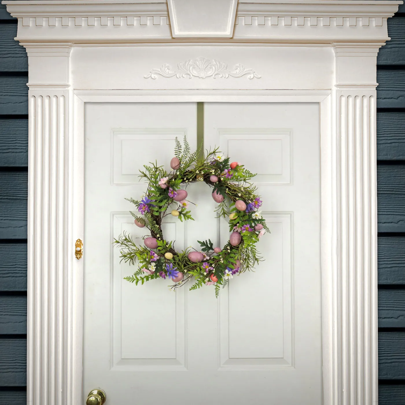 National Tree Company 22 in. Easter Wreath Decorated with Pink Pastel Eggs, Purple Flowers, Ferns, Leafy Greens