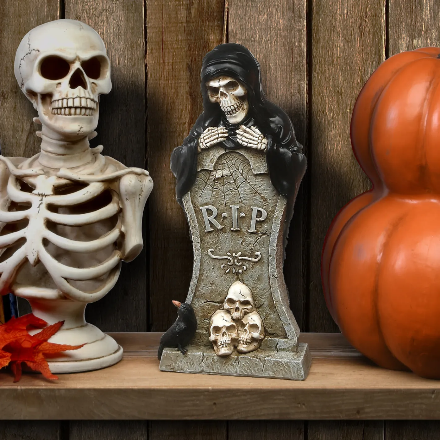 National Tree Company 12 in. Halloween Skeleton Behind a Tombstone Decoration