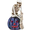 National Tree Company 11 in. Halloween Skeleton Resting on a Purple Galaxy Jack O Lantern