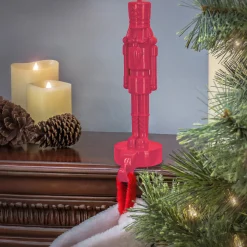 National Tree Company 10 in. HGTV Home Collection Resin Nut Cracker- Pink Stocking Holder