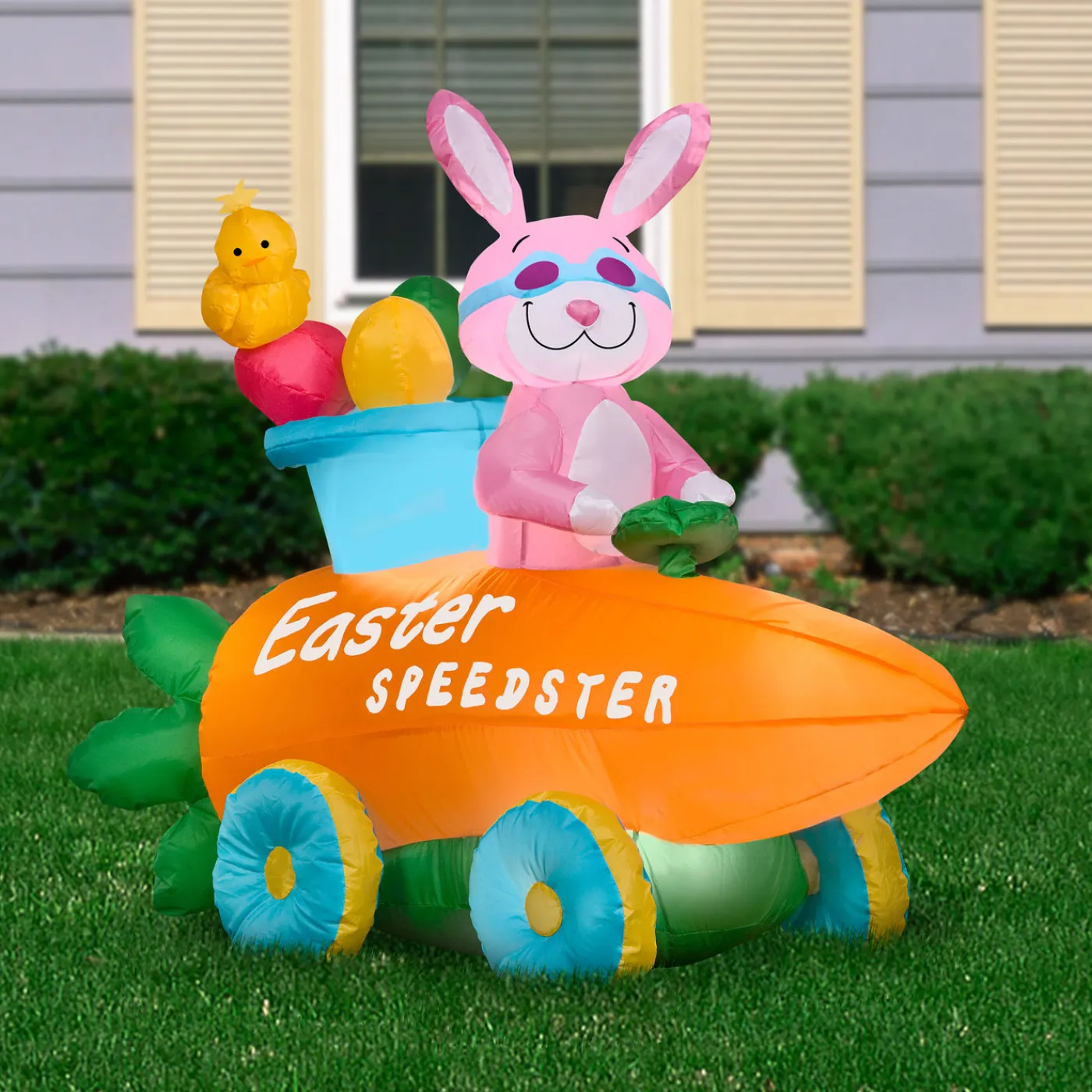 National Tree Company 54 in. Inflatable Easter Bunny in a Carrot Roadster Decoration