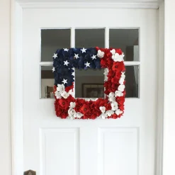 National Tree Company 22 in. Patriotic Hanging Square Wreath with Red White and Blue Flowers Stars
