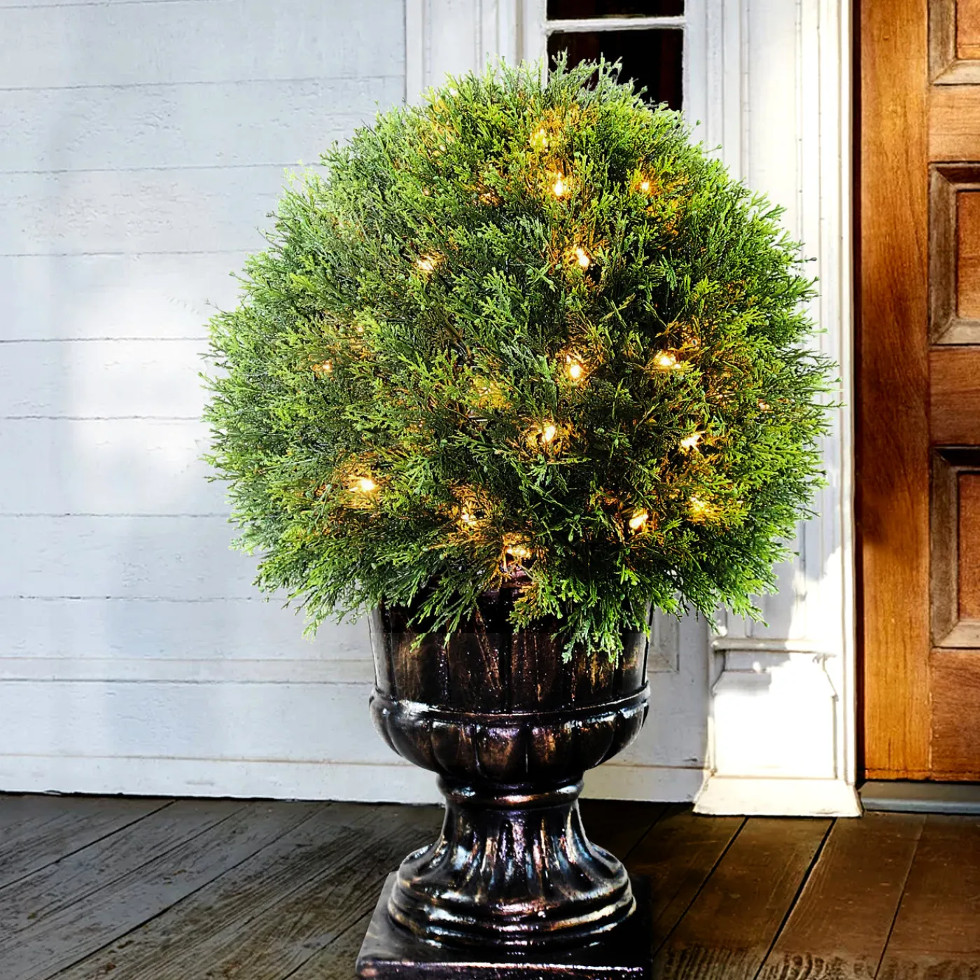 National Tree Company 27 in. Pre-Lit Upright Juniper Ball Topiary Tree in a Decorative Urn with Clear Lights
