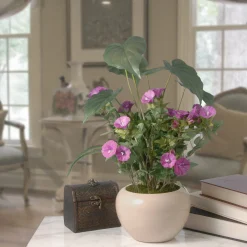National Tree Company 18 in. Spring Purple Flower Blooms Potted Plant in a Cream Ceramic Pot