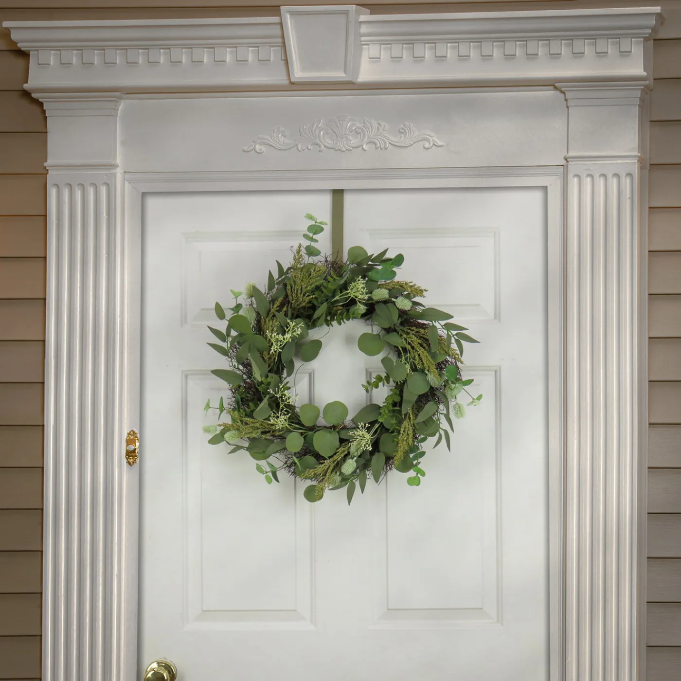 National Tree Company 22 in. Spring Wreath with Eucalyptus Leaves, Baby's Breath, Flowing Green Stems